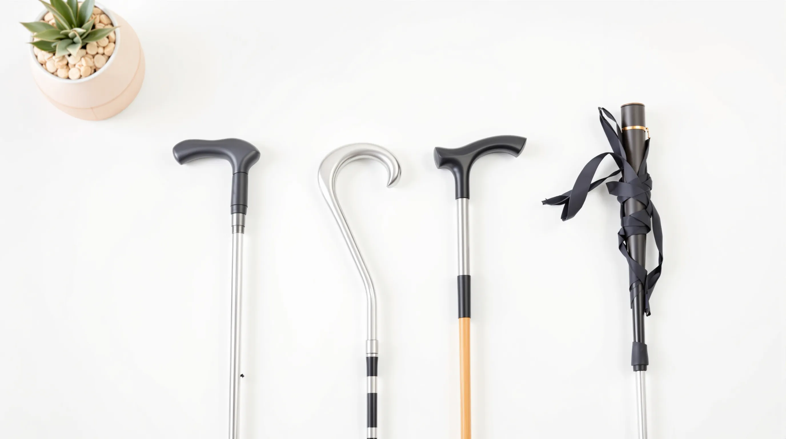 Four types of walking canes side by side: standard, offset, quad, and folding